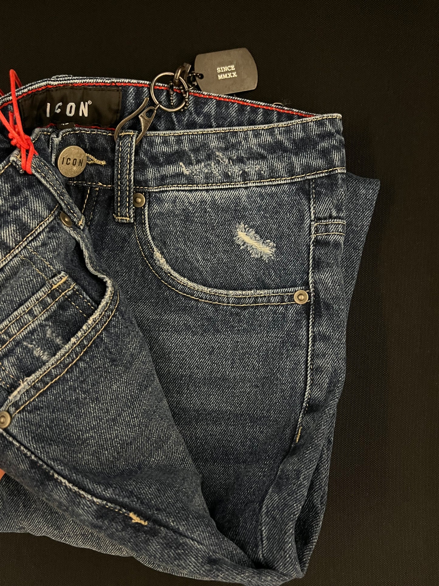Jeans 5 tasche c/abrasioni c/logo