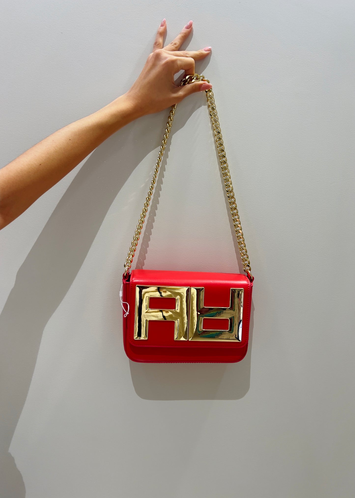 Pochette Artigli con catena corallo