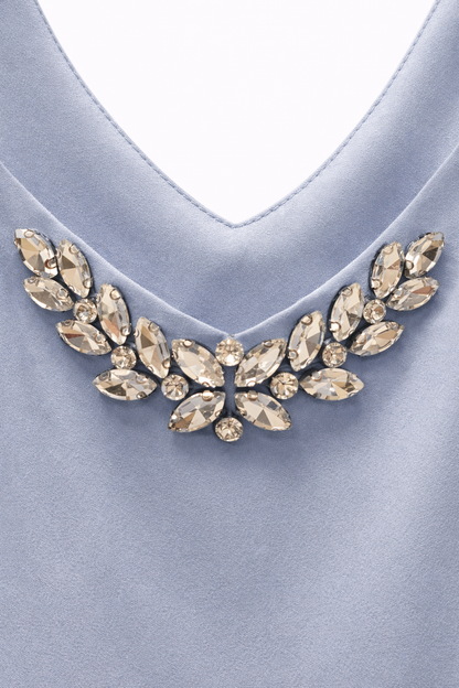 Top bretelle con scollo