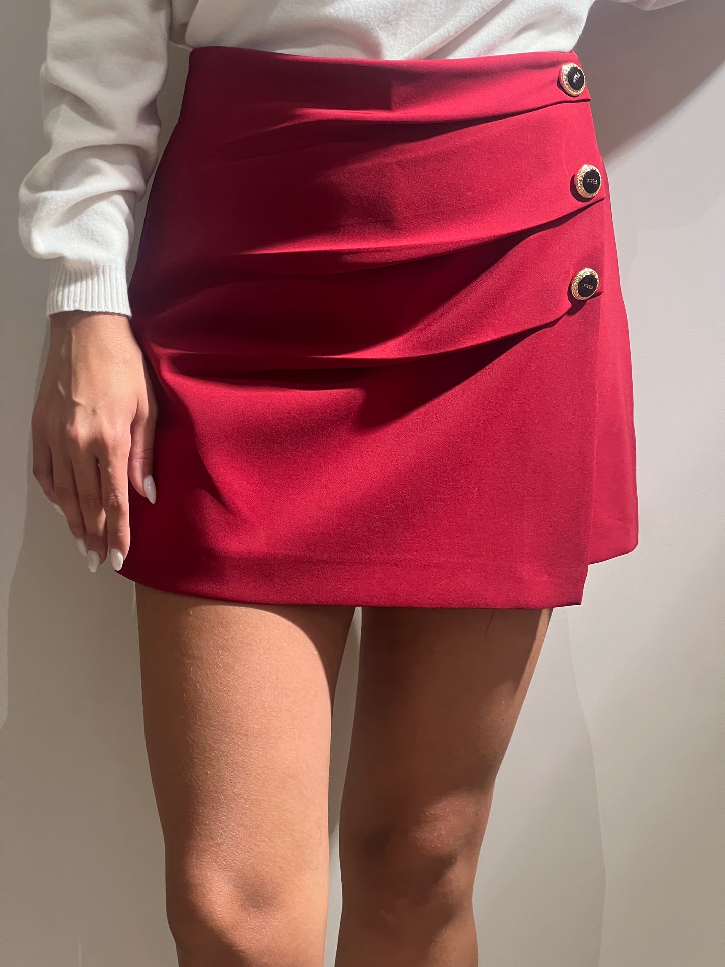 Shorts con pannello bottoni