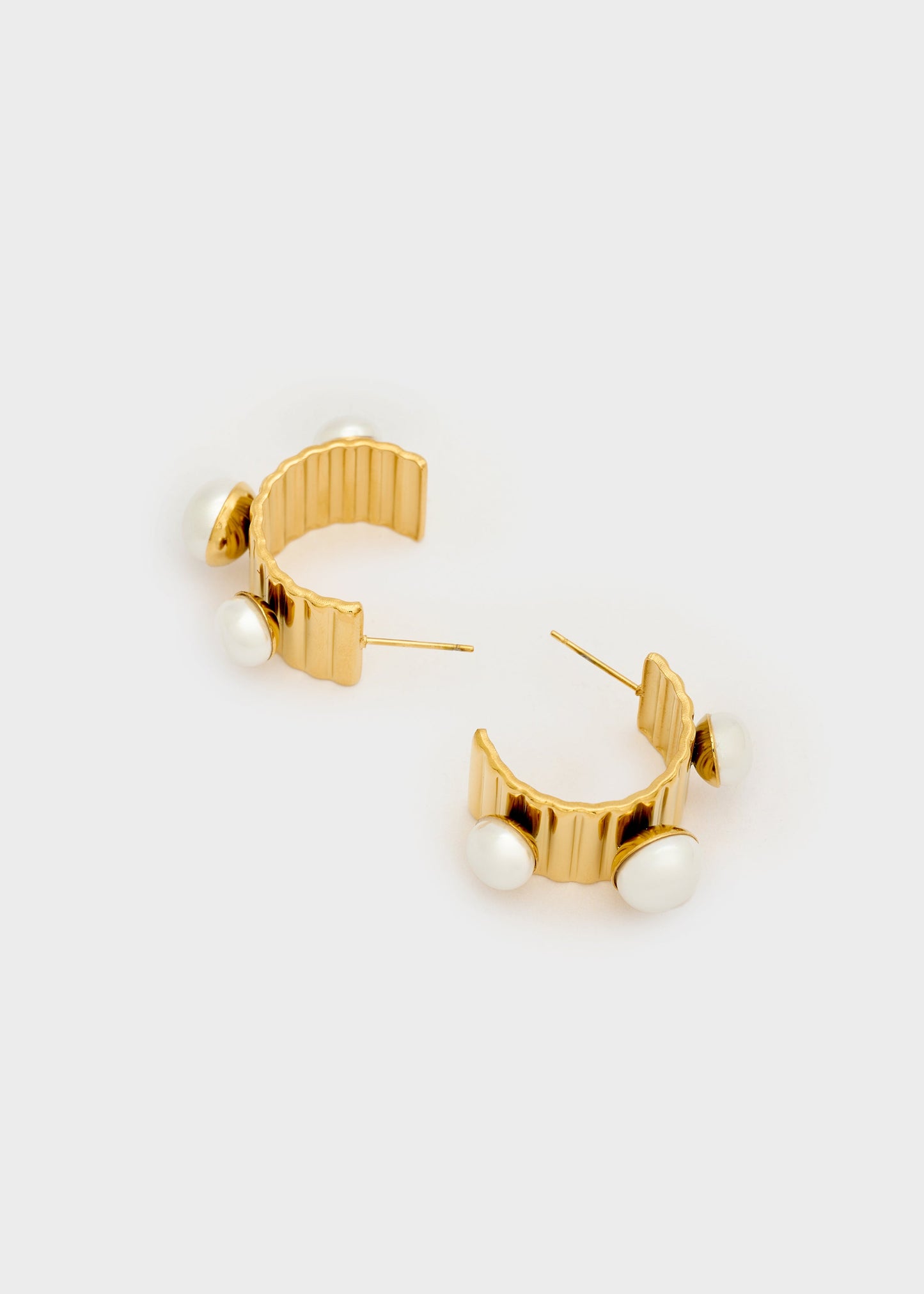 Orecchini semicerchio perle